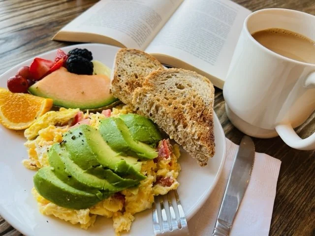 Breakfast with scrambled eggs, avocado, toast, fruit and coffee at Jennings House